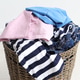 Laundry basket full of clothes indoors, closeup Laundry basket full of clothes indoors, closeup - PhotoDune Item for Sale