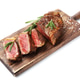 Cut tasty beef steak with salt and rosemary isolated on white Cut tasty beef steak with salt and rosemary isolated on white - PhotoDune Item for Sale