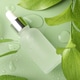 Bottle of cosmetic oil and wet leaves on green background, flat lay Bottle of cosmetic oil and wet leaves on green background, flat lay - PhotoDune Item for Sale