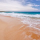 Sunny beach in Hawaii with golden sand, clear water under a bright sky Sunny beach in Hawaii with golden sand, clear water under a bright sky - PhotoDune Item for Sale