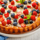 Homemade berry tart topped with fresh raspberries and blueberries Homemade berry tart topped with fresh raspberries and blueberries - PhotoDune Item for Sale