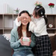 Daughter surprising mother with a gift on Mother's Day Daughter surprising mother with a gift on Mother's Day - PhotoDune Item for Sale