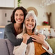 Smiling loving daughter and senior mother looking at camera Smiling loving daughter and senior mother looking at camera - PhotoDune Item for Sale