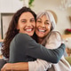 Senior mother hugging adult daughter at home with a big laugh Senior mother hugging adult daughter at home with a big laugh - PhotoDune Item for Sale