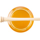 Golden honey jar with wooden dipper top view Golden honey jar with wooden dipper top view - PhotoDune Item for Sale