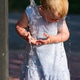 Toddler Playing Under Outdoor Water Fountain Toddler Playing Under Outdoor Water Fountain - PhotoDune Item for Sale