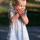 Toddler Splashing Face at Public Fountain Toddler Splashing Face at Public Fountain - PhotoDune Item for Sale
