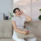 Young woman enjoying music on headphones at home Young woman enjoying music on headphones at home - PhotoDune Item for Sale
