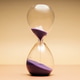 Hourglass with purple sand, passing time, aging process and life transition concepts Hourglass with purple sand, passing time, aging process and life transition concepts - PhotoDune Item for Sale