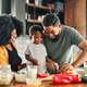 Child Family Kitchen Food Boy Son Mother Father Meal Preparing Healthy Diet Eating Home Black Africa Child Family Kitchen Food Boy Son Mother Father Meal Preparing Healthy Diet Eating Home Black Africa - PhotoDune Item for Sale