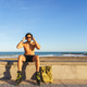 Young man rollerblading on beach promenade listening music Young man rollerblading on beach promenade listening music - PhotoDune Item for Sale