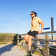Young latino man enjoying summer day at beach Young latino man enjoying summer day at beach - PhotoDune Item for Sale
