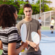 Pickleball sports player team talking on outdoor court. Smiling man and woman holding paddle and yel Pickleball sports player team talking on outdoor court. Smiling man and woman holding paddle and yel - PhotoDune Item for Sale