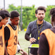 Coach explaining tactics and strategy to soccer players on the field. Teamwork, planning, and profes Coach explaining tactics and strategy to soccer players on the field. Teamwork, planning, and profes - PhotoDune Item for Sale