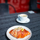 Savory breakfast croissant sandwich with scrambled egg and sauce close up Savory breakfast croissant sandwich with scrambled egg and sauce close up - PhotoDune Item for Sale