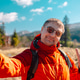Happy young man tourist taking selfie photo in mountains close up Happy young man tourist taking selfie photo in mountains close up - PhotoDune Item for Sale