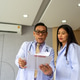 Doctor Pointing at Medical Document with Colleague Doctor Pointing at Medical Document with Colleague - PhotoDune Item for Sale