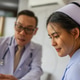 Doctor Discussing Digital Tablet with Smiling Nurse Doctor Discussing Digital Tablet with Smiling Nurse - PhotoDune Item for Sale