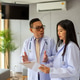 Doctor in Contemplation Discussing Document with Colleague Doctor in Contemplation Discussing Document with Colleague - PhotoDune Item for Sale