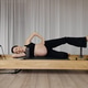 Pregnant woman doing Pilates reformer workout in bright wellness studio Pregnant woman doing Pilates reformer workout in bright wellness studio - PhotoDune Item for Sale