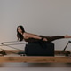 Pilates Reformer machine with Pilates box used by model in studio Pilates Reformer machine with Pilates box used by model in studio - PhotoDune Item for Sale