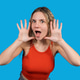 Young woman shouting with surprised excited expression Young woman shouting with surprised excited expression - PhotoDune Item for Sale