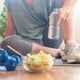 Woman hydrating with water and weights after workout Woman hydrating with water and weights after workout - PhotoDune Item for Sale