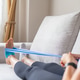 Woman performing foot rehabilitation exercise with resistance band Woman performing foot rehabilitation exercise with resistance band - PhotoDune Item for Sale