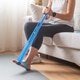 Woman performing foot rehabilitation exercise with resistance band at home Woman performing foot rehabilitation exercise with resistance band at home - PhotoDune Item for Sale