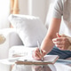 Woman with hand splint filling out insurance report Woman with hand splint filling out insurance report - PhotoDune Item for Sale