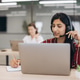 Customer support agent working in a call center, wearing a headset and talking with clients while ma Customer support agent working in a call center, wearing a headset and talking with clients while ma - PhotoDune Item for Sale