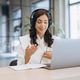 Professional woman wearing headphones, having a video conference call on laptop, discussing work in Professional woman wearing headphones, having a video conference call on laptop, discussing work in - PhotoDune Item for Sale