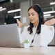 Professional woman wearing headphones, having a video conference call on laptop in modern office, co Professional woman wearing headphones, having a video conference call on laptop in modern office, co - PhotoDune Item for Sale