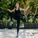 Outdoor shot of athletic motivated woman jumps high does physical exercises keeps hands and legs rai Outdoor shot of athletic motivated woman jumps high does physical exercises keeps hands and legs rai - PhotoDune Item for Sale