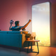 Man Watching Soccer on Giant Futuristic Screen at Home Man Watching Soccer on Giant Futuristic Screen at Home - PhotoDune Item for Sale