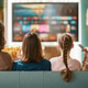 Happy Family Watching Television Together On Couch at Home with Popcorn Happy Family Watching Television Together On Couch at Home with Popcorn - PhotoDune Item for Sale
