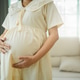 Asian Pregnant middle aged mother portrait. Pregnant happy Woman touching her belly, caressing her b Asian Pregnant middle aged mother portrait. Pregnant happy Woman touching her belly, caressing her b - PhotoDune Item for Sale