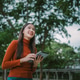 Cheerful Female Student With tablet Standing Outdoors, Happy Young Asian Woman Walking In City After Cheerful Female Student With tablet Standing Outdoors, Happy Young Asian Woman Walking In City After - PhotoDune Item for Sale