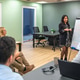 Confident hispanic woman leading a business presentation using whiteboard in meeting Confident hispanic woman leading a business presentation using whiteboard in meeting - PhotoDune Item for Sale