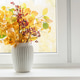 Autumn bouquet of colorful fall branches in white ceramic vase on bright window sill. Vertical forma Autumn bouquet of colorful fall branches in white ceramic vase on bright window sill. Vertical forma - PhotoDune Item for Sale