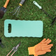 Gardening tools and kneeling pad on grass flat lay with copy space Gardening tools and kneeling pad on grass flat lay with copy space - PhotoDune Item for Sale