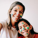 Happy latina mother and daughter having fun with painted face at home - Family love life concept Happy latina mother and daughter having fun with painted face at home - Family love life concept - PhotoDune Item for Sale