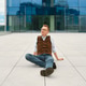 Middle-aged man sits on floor of modern building in city during sunny day Middle-aged man sits on floor of modern building in city during sunny day - PhotoDune Item for Sale
