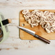 Cutting mushrooms next to air fryer on wooden surface in kitchen Cutting mushrooms next to air fryer on wooden surface in kitchen - PhotoDune Item for Sale