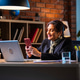 Senior Indian female executive chatting on mobile phone at office desk with laptop computer Senior Indian female executive chatting on mobile phone at office desk with laptop computer - PhotoDune Item for Sale