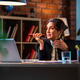 Experienced senior Indian female executive multitasking on speaker call and laptop at desk Experienced senior Indian female executive multitasking on speaker call and laptop at desk - PhotoDune Item for Sale