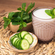 Enjoying traditional Saudi Arabian or Turkish drink with mint and cucumber slices Enjoying traditional Saudi Arabian or Turkish drink with mint and cucumber slices - PhotoDune Item for Sale