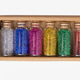 Bottles of glitter in a box for crafting projects and decorations Bottles of glitter in a box for crafting projects and decorations - PhotoDune Item for Sale