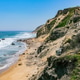 Scenic view of Mohegan Bluffs and a rugged secluded beach on Block Island’s southern coast. Scenic view of Mohegan Bluffs and a rugged secluded beach on Block Island’s southern coast. - PhotoDune Item for Sale