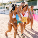 Happy friends walking on the beach, enjoying summer vacation Happy friends walking on the beach, enjoying summer vacation - PhotoDune Item for Sale